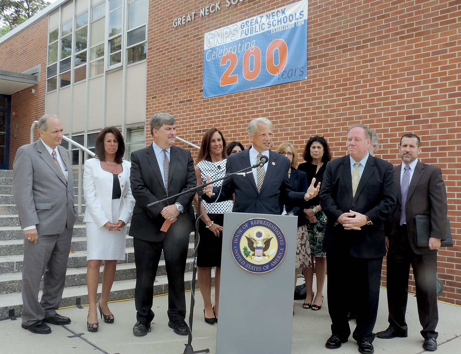 Outgoing US Congressman Steve Israel with Great Neck (marking its 200th anniversary as a public school district) and Long Island educators, in front of Great Neck South Middle School, appeals for the Department of Education to change its rules regarding over-testing. The White House has just announced new steps to create “better, fairer and fewer tests” © 2016 Karen Rubin/news-photos-features.com
